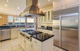 The recently updated kitchen includes top-of-the-line appliances and finishes. 