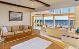 An open floor plan provides continuous living spaces with uninterrupted ocean views. 