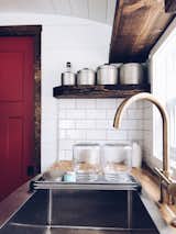 With natural wood elements, shiplap siding on both the walls and ceiling, and modern fixtures, the bus has really transformed into a cozy, comfortable home.