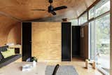 To keep costs low, architect Mark Fullagar fitted this compact cabin with hollow-insulated plywood panels that lend warmth and texture to the interior.&nbsp;&nbsp;