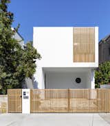 From the street, the house appears as a simple, white structure with timber elements.  It’s not until you enter that the lightness and porosity of the home becomes apparent.
