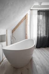 The bath is a serene, relaxing retreat complete with a soaking tub.