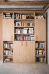 A custom-made shelving unit provides plentiful storage for the family's collection of books. 