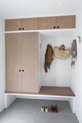 By reconfiguring the main areas, the designer was able to incorporate a mudroom area with custom bamboo built-ins.