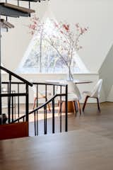 The spiral staircase has been revamped with new wood stair treads that tie in with the wood floors. 