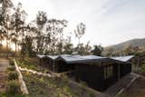 A low-lying structure with a folded roof plane, Casa Origami is a unique solution for a hillside retreat that embraces the climate and setting. 