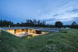 The home’s L-shaped layout is reminiscent of farms in the Warmian-Masurian Voivodeship, and it shields against strong winds from the lake beyond.