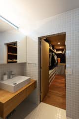 A large walk-in closet lies adjacent to the washroom and bath on the main floor. 