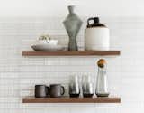 Floating wood shelves provide an ideal location for displaying special glassware and decor items. 