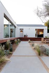 Courtyard House by And And And Studio concrete pavers in the courtyard