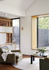 A timber window seat is surrounded by secret storage cabinets, adding functionality to otherwise unused space.&nbsp;
