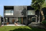 Pockets of Greenery Punctuate This Dramatic Black House in Mexico City