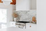 Sarah worked with Cafe Appliances to bring her vision to life. The matte white appliances blend in with the rest of the home and the warm bronze appliance hardware adds just the right metallic accent.