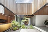 Garden and living spaces blend together in this Australian dwelling which inverts the classic wraparound veranda.