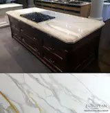 Featured in this kitchen island countertop, Borghini marble is a classic, timeless and breathtaking stone.

This marble exhibits heavy veining patterns of gold and grey across a backdrop of soft white in a polished finish: http://www.egmcorp.com/marble/calacatta-borghini-0
