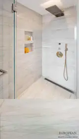 The luxurious shower features Stellar White marble on all sides. 
This beige natural stone has subtle veining throughout, which gives the shower design a sleek and stylish appearance.

View our marble range here: http://www.egmcorp.com/stone-types/marble