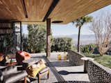Blur the threshold: The living room extends to the exterior patio as the exterior materials become the interior materials