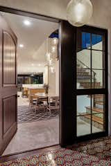 Exterior entry opens to stair, dining room, kitchen, living room and yard at rear