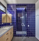 Enclosed shower with skylight above. Daltile "Cobalt" semi-gloss tile