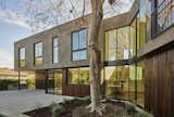This two-story home is designed to bend around the existing 50-foot tall elm tree. We placed the interior staircase at this junction so the owner may enjoy the tree's glory everyday.
