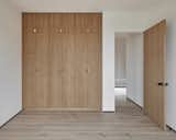 All guest and children's bedrooms have bespoke built-in white oak closets with brass hardware