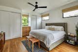 Bedroom framing trees with balanced natural light