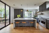 Open kitchen with an extra deep island: It is fitted with a full Fisher & Paykel suite of appliances and opens to a covered outdoor dining deck and backyard: This kitchen is fantastic for entertaining.