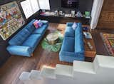 The living room with entry to right as one climbs the staircase to the second floor primary suite.