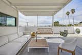 Gloriette / family outdoor living room with LA skyline from the east beyond. Modernism in an urban setting. Doggie window at right
