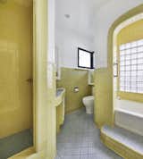 1930s and 1940s tiled bathroom. Tiled in vanity! Funky with glass block for the win