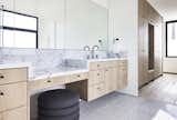 Vanity with makeup station at Primary Bathroom. Primary closet suite to right