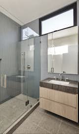 California beach tones of the guest bathroom with terrazzo tile floors