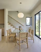 Dining room with Isamu Noguchi pendant for Herman Miller, adjacent to patio