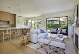 Living Room is open to rear yard, kitchen and dining room