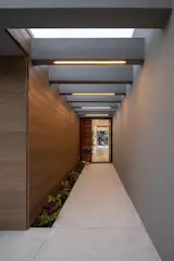 A view through the entryway reveals the procession through the home to the patio...