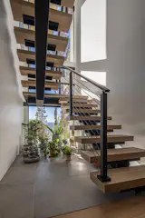 The stairwell is open and filled with light.