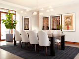 The Client’s existing artwork is framed for repetition for the Dining Room wall and is juxtaposed by another work of art, the free form Branching Disc Chandelier by Lindsey Adelman that hangs above the dining room table.