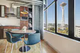 The look of the room was driven by Seattle and the northwest, with a particular focus on northwest music. Plaid draperies invoke the feeling of the early ‘90’s Seattle grunge scene, while providing privacy and light control.
