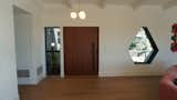 Features the custom front door and hexagon window.