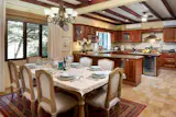 Dining for up to 10 and gourmet kitchen in the background