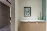 Artwork is used to highlight the foyer that leads into the master bedroom. 