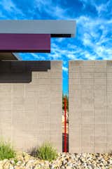 Detail of the rain water collection scupper, exposed central beam and entry wall.