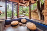 The privacy of Trillium House allows for expansive shower windows.  Leather granite and boulders add to the illusion of bathing al fresco.