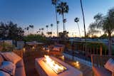 Rooftop deck with fire pit with seating for outdoor entertaining. 