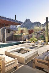 Outdoor, Hardscapes, Boulders, Planters Patio, Porch, Deck, and Desert Outdoor living at our Collector's Paradise project centers on fire, water, and mountain views.   Photo 13 of 16 in A Collector's Paradise in Estancia by Drewett Works