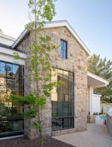 Large custom wood clad windows and doors complement the modern aesthetic of this award-winning fresh interpretation of the western farmhouse. 
