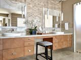 Bath Room, Limestone Floor, Stone Counter, Stone Tile Wall, Open Shower, Ceiling Lighting, Vessel Sink, Porcelain Tile Floor, and Pendant Lighting Rift cut white oak custom cabinetry adds texture and warmth to the master bathroom.  Photo 13 of 16 in Desert Prairie by Drewett Works