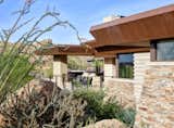 Linear interior and exterior walls reminiscent of Frank Lloyd Wright's work deliver an undeniable yet effortless through-line.   Photo 7 of 16 in Desert Prairie by Drewett Works