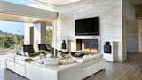 Indoor living spaces enveloped by pocketing glass doors open to outdoor paradise. This great room merges with the rear-flanking bridge expanding its footprint. The fully automated home includes a stunning lighting package designed by the owner, an electrical engineer.  