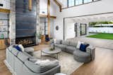As the great room's pocketing glass doors disappear, the fun begins. Beyond is The Stone Bar, a destination game room with an indoor/outdoor bar and entertaining space behind more disappearing doors.  